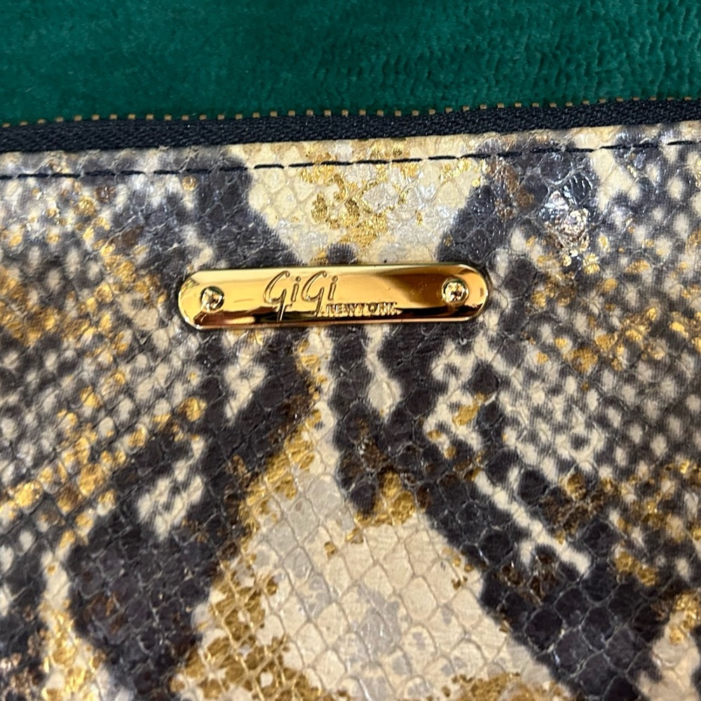 Gigi New York snakeskin clutch with black tassels